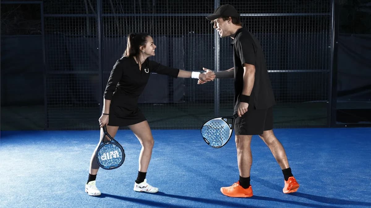 Mixed doubles padel players during a tournament